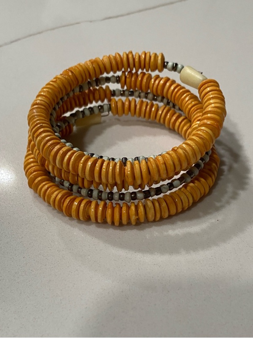 Noonday Collection Mustard Coil Bead Bracelet